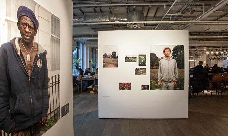 A photography exhibition, featuring prominently photographs of homeless men.