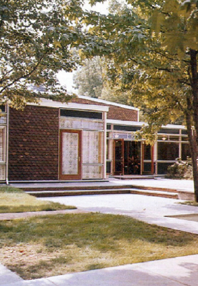 Outside photo of school on sunny day.