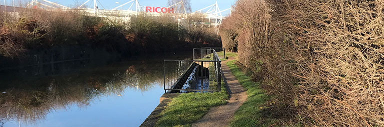 Canal towpath with Ricoh Arena in the distance