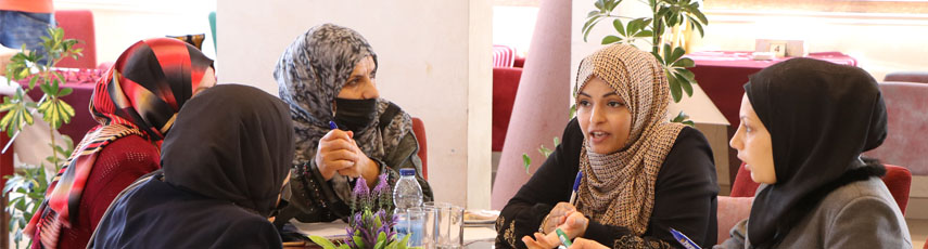 Group of women sat round a table