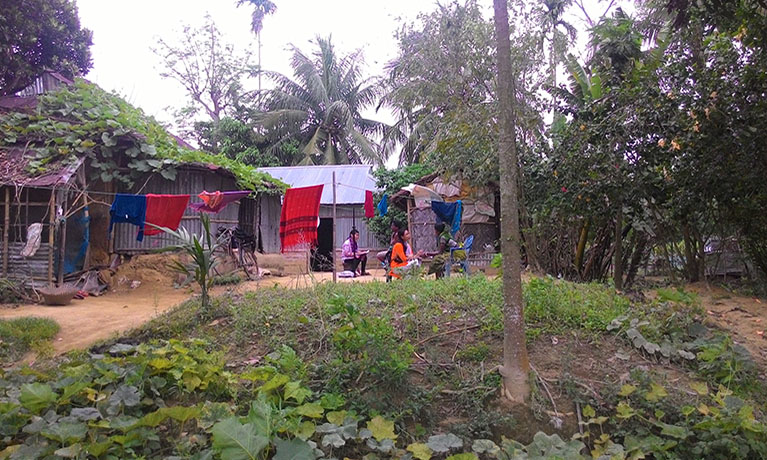 A small rural hut with washing on a line outside.