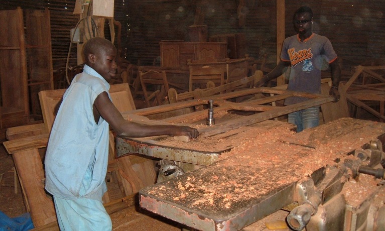 A man cutting rosewood