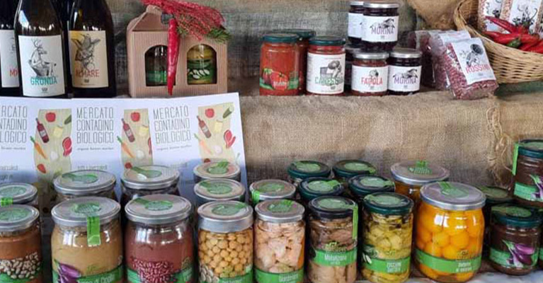Local food produce displayed on tiered tables