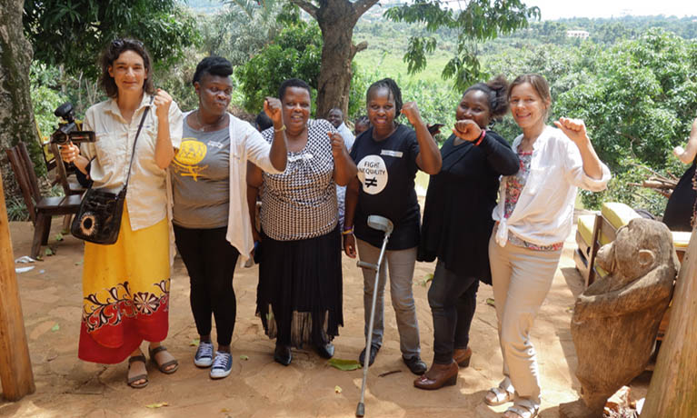 CAWR researchers standing with women land owners.