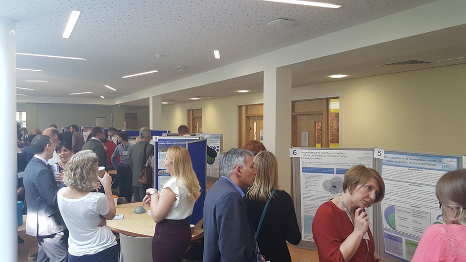 people talking at exhibition stands