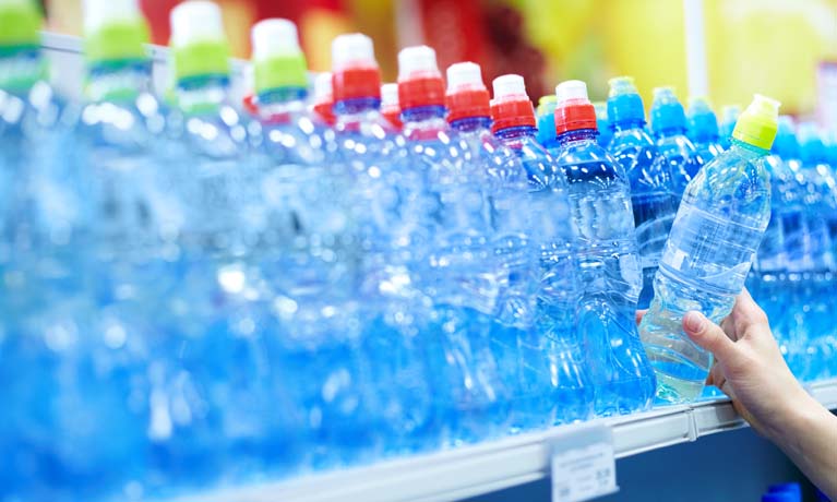 Bottle of water on a supermarket shelf.