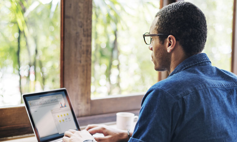 Male studying in private space on laptop