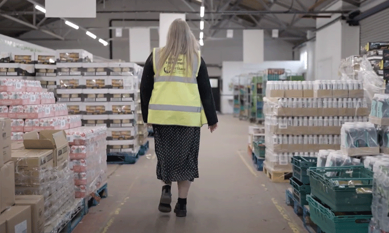 Dr Marsha Smith walking through a food storage facility