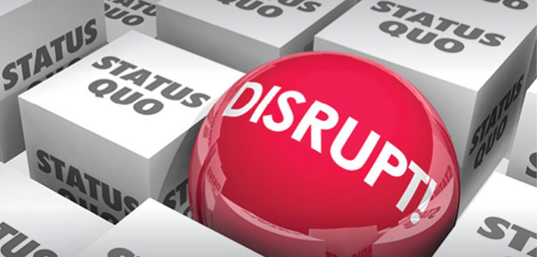 Red button with the word disrupt on a black and white keyboard