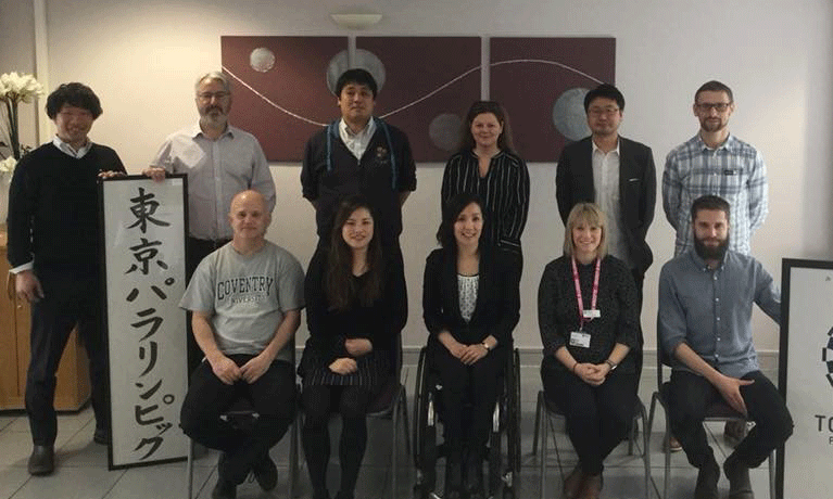 Group of 11 researchers gather for photo.