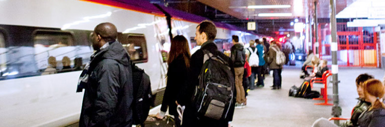 People waiting at a platform in Coventry Train station
