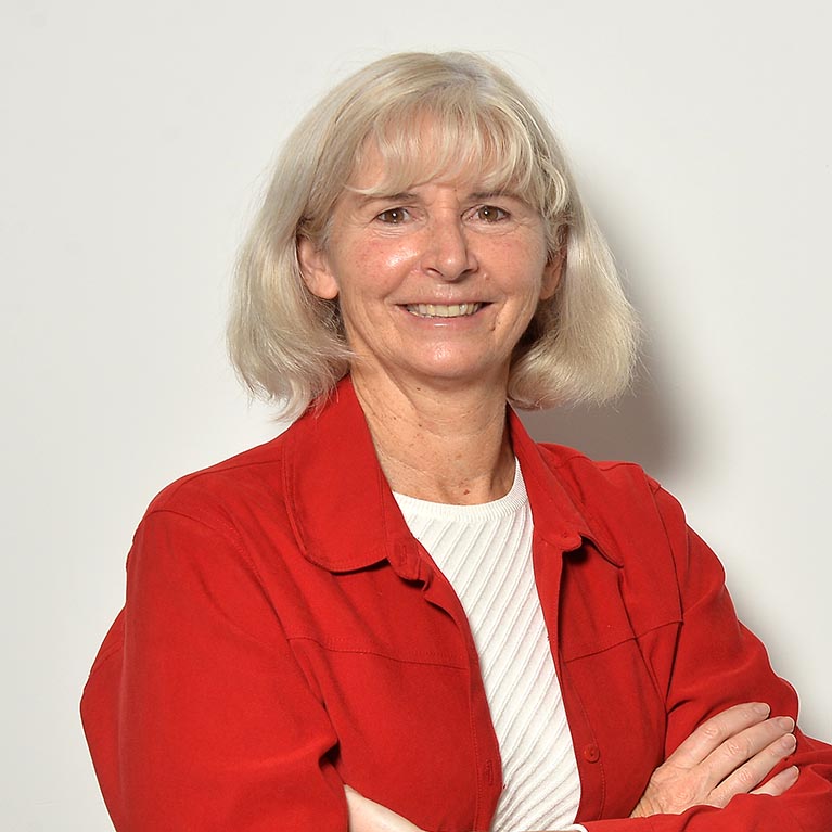 Blonde lady wearing red jacket