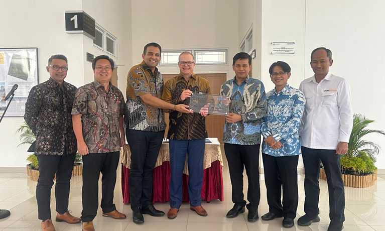 Professors Richard Dashwood and Rohit Bhagat with UGM employees