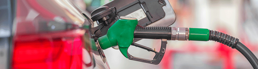 unleaded petrol pump inserted into side of car