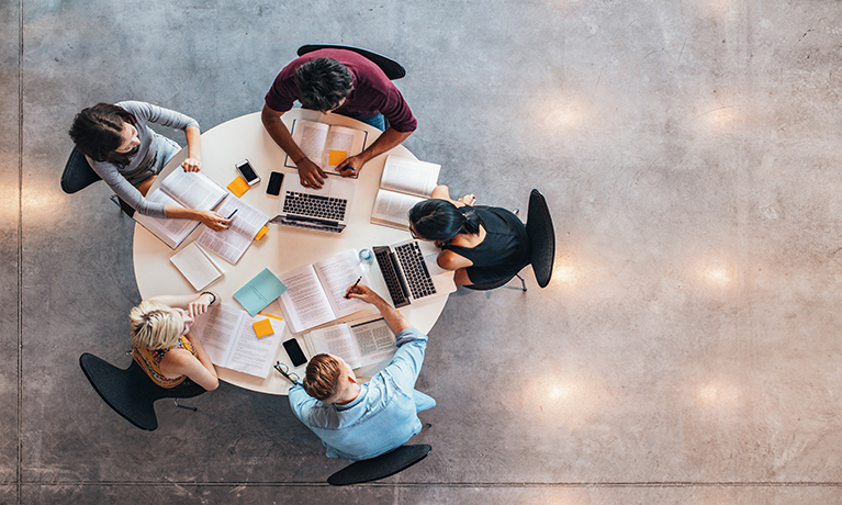 Arial view of students sitting at a table working