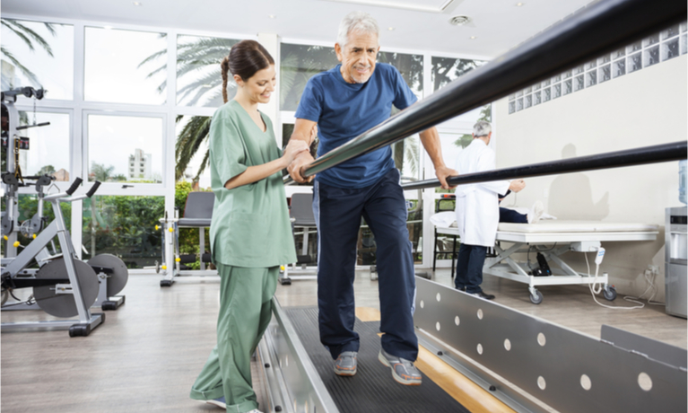 Man walking on a treadmill as part of his care