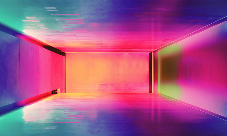 A room illuminated by bright yellow and purple neon colours