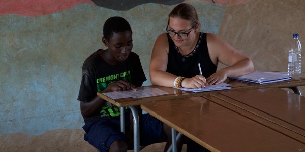 Woman helping a child with homework