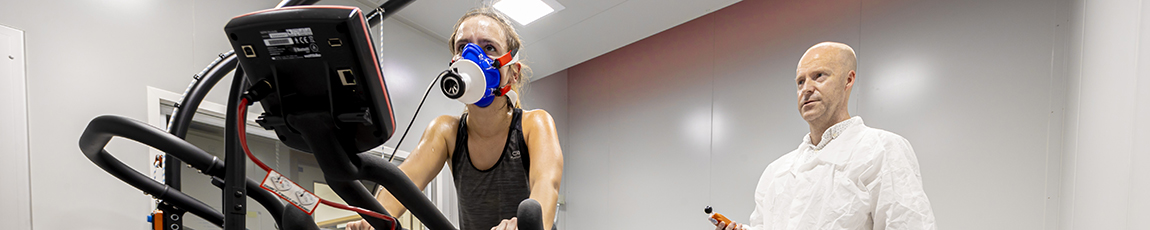 Women on treadmill with oxygen mask on