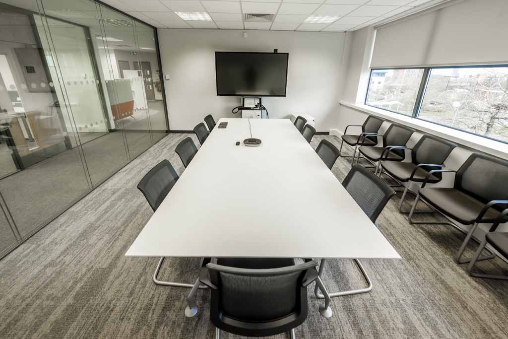 CSM meeting space with large table and chairs and all AV equipment
