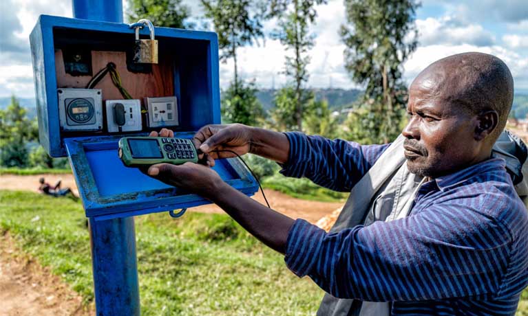 Male accessing solar panelled energy 
