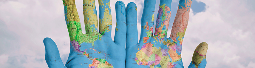 World map painted on hands