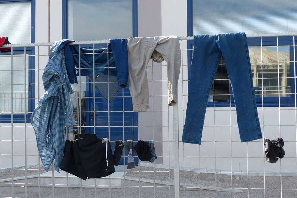 Clothes drying over a railing fence