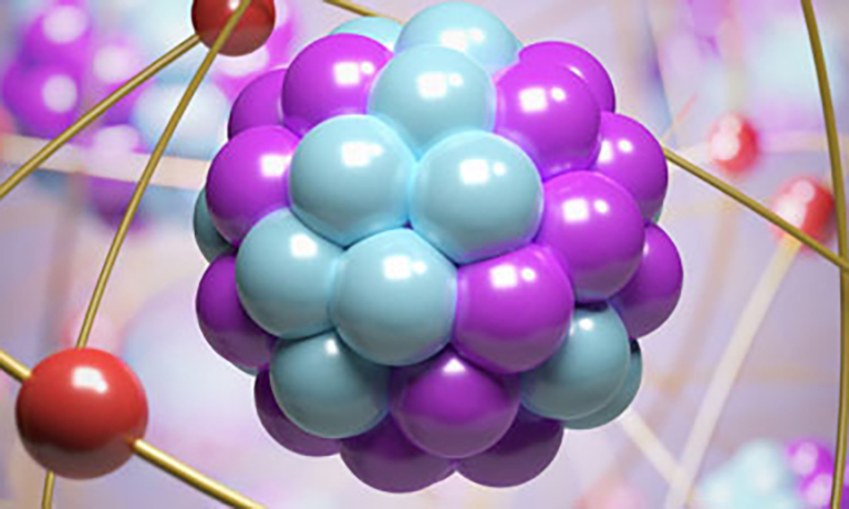 Blue and purple balls in a cluster, representing an atom