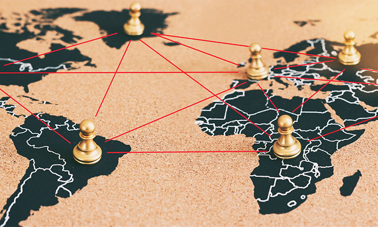 Chess figures pinned on world map
