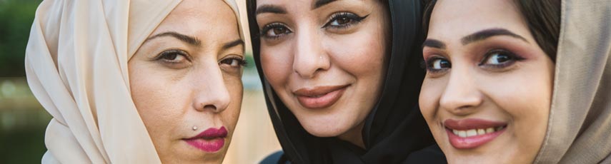 Multi ethnic group of females outside smiling