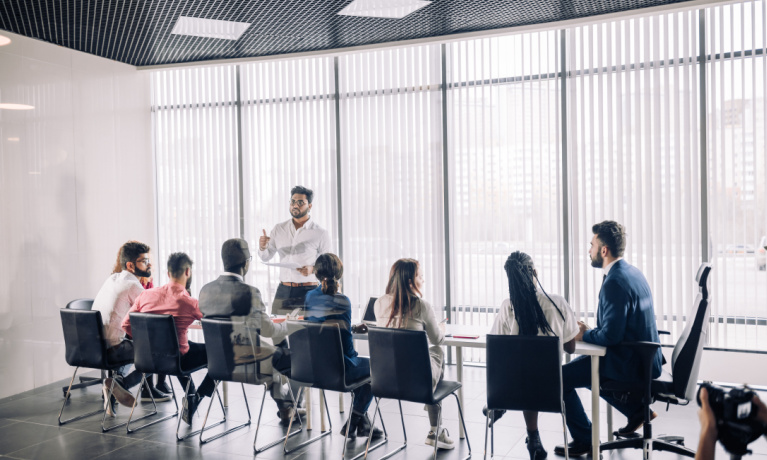 training session in a room with people around a table