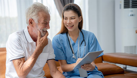 Man sat with a nurse