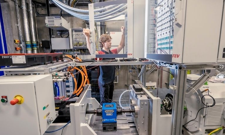 person opening transparent cabinet in a lab setting person opening transparent cabinet in a lab setting