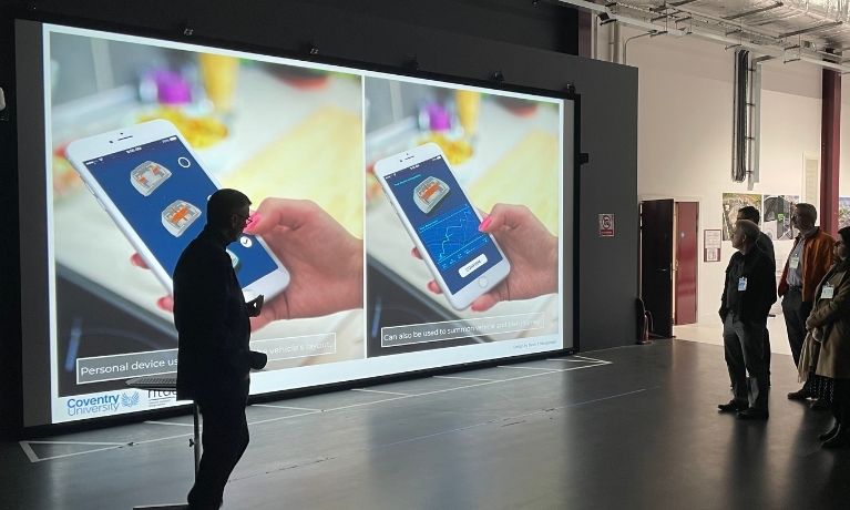 silhouette of a person in front of a large wall to ceiling display wall silhouette of a person in front of a large wall to ceiling display wall