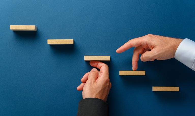 Hand climbing steps with fingers.