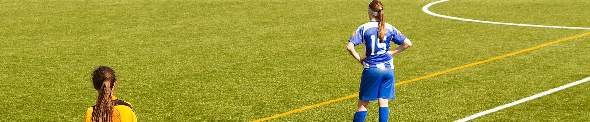 Woman football referee observing game