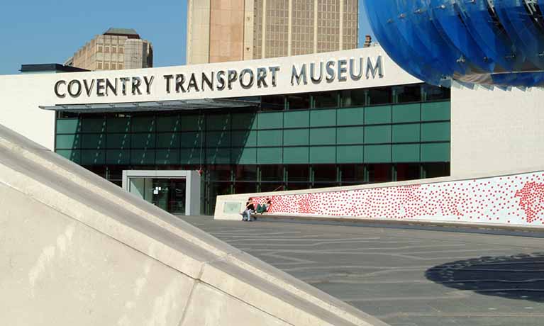Exterior shot of Coventry Transport Museum on a sunny day.