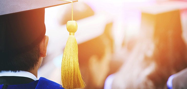 Graduating students wearing graduation hats