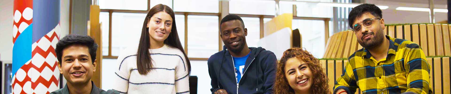 group of diverse students sitting in the Student Hub