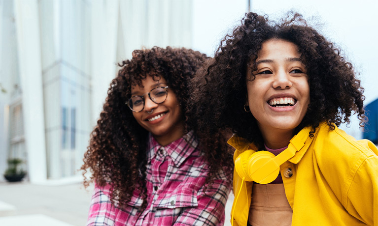 two girls with beautiful curly hair