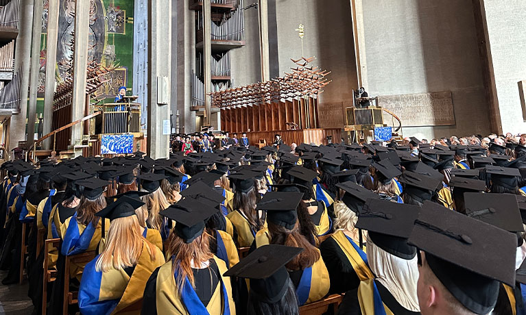 Coventry University graduates in Coventry Cathedral