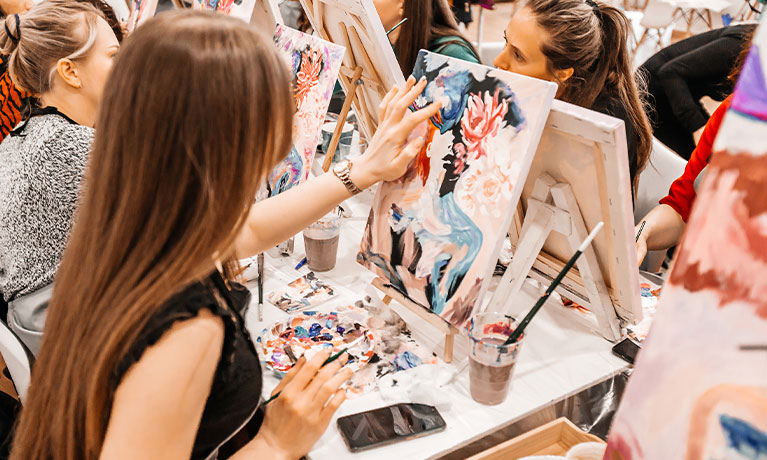 Person painting on a canvas