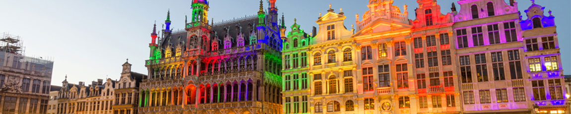 Buildings in Brussels lit up with bright multicoloured lights.