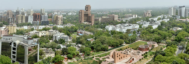 View of Delhi buildings and greenery.