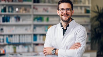 Man in a lab coat in a medical room 