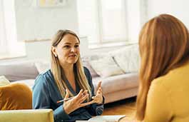 Two women in discussion 