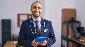 Professional looking man in a suit with a stethoscope around his neck