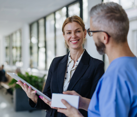 A businesswoman talking with a healthcare professional.