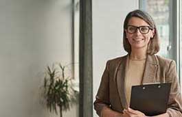 professional woman holding a clip board