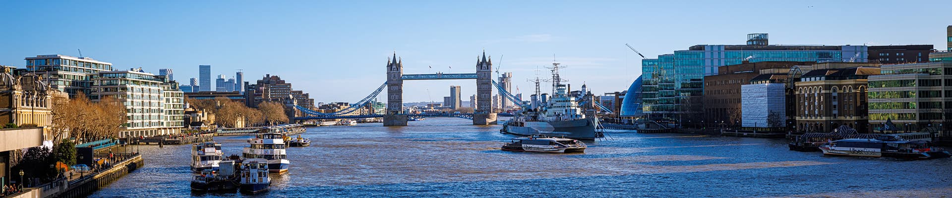 River thames with the tower of london bridge in the distance